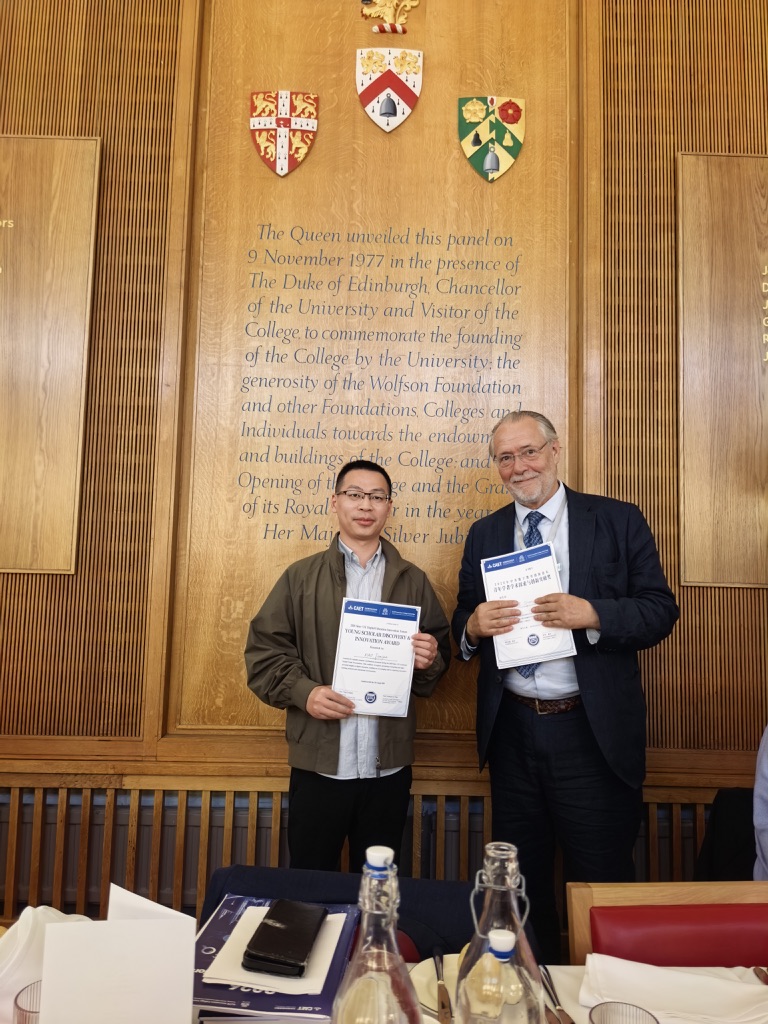 Receiving the Young Scholar Award at Wolfson College, University of Cambridge